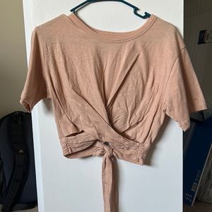 Light pink/beige crop top with knot on bottom